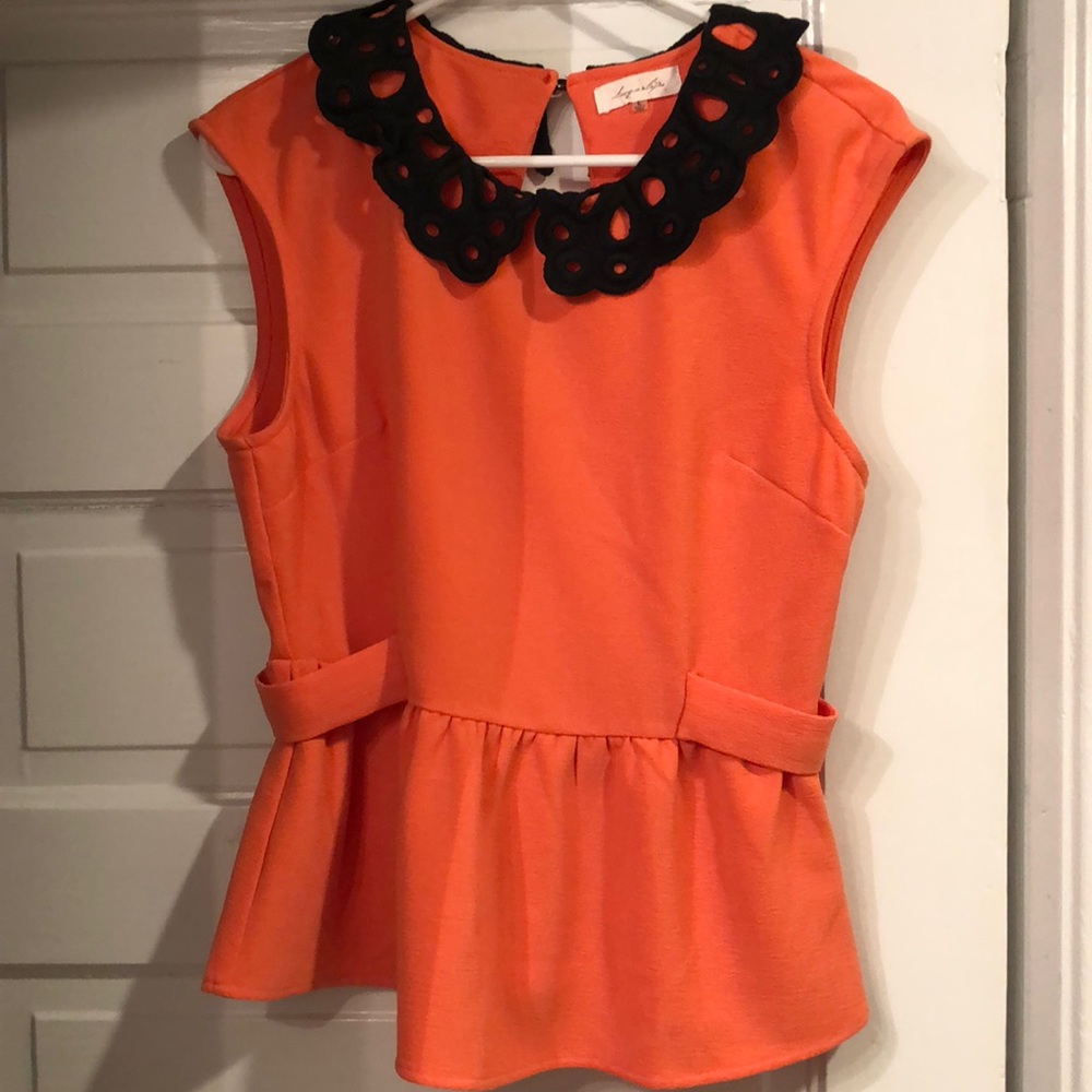 Size large never worn Orange Peplum Top